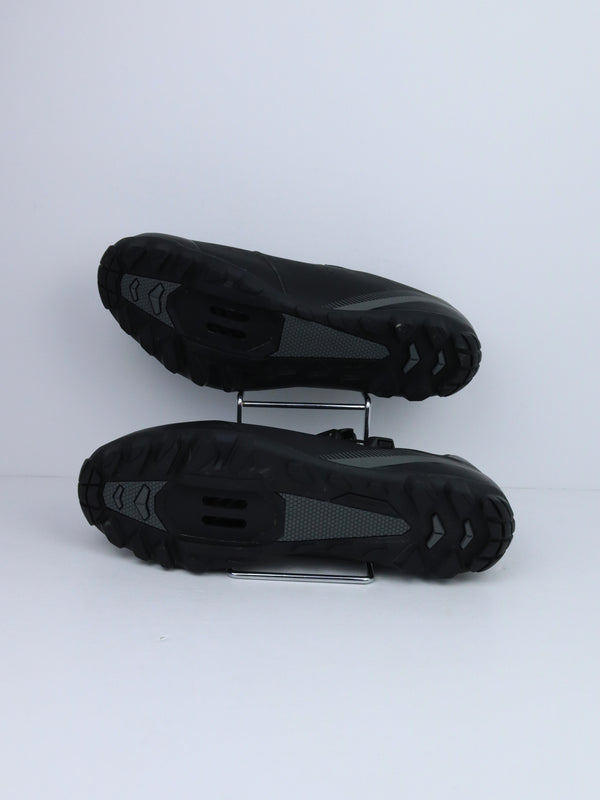 Shimano SH-ME3 (or SH-ME301) mountain bike shoes with a rubber outsole and two hook-and-loop straps.