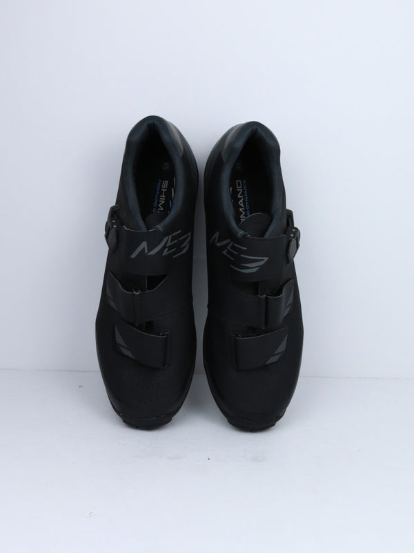 Shimano SH-ME3 (or SH-ME301) mountain bike shoes with a rubber outsole and two hook-and-loop straps.