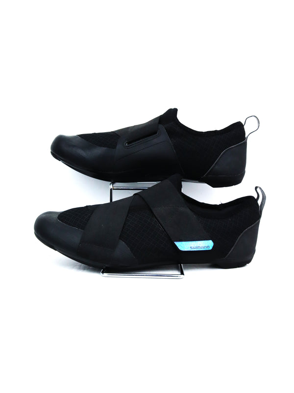 black Shimano SH-IC100 indoor cycling shoes.