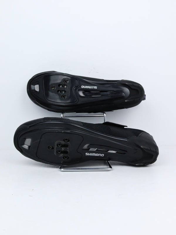 black Shimano SH-IC100 indoor cycling shoes.