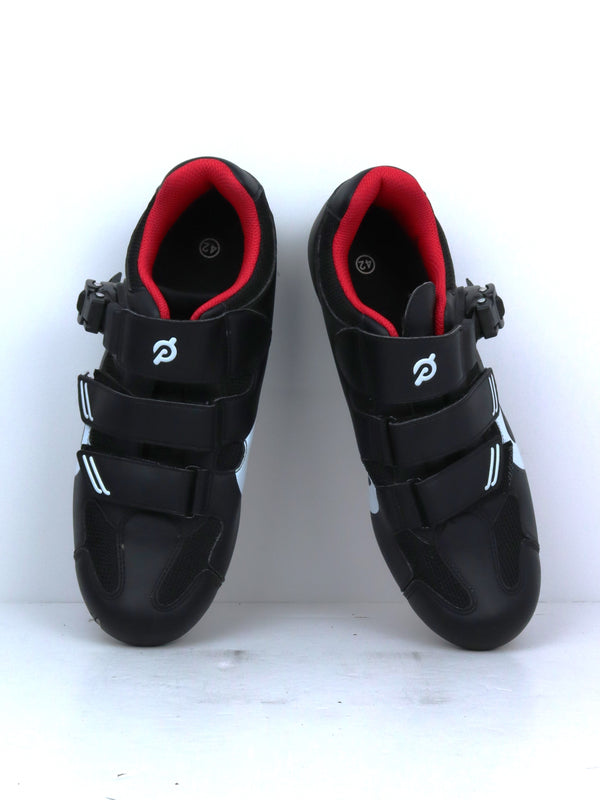 Peloton cycling shoes with red accents.