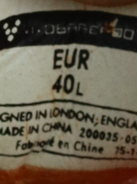 Vivobarefoot Primus Lite women's barefoot exercise shoes in an orange and lime green colorway with a hexagonal pattern.