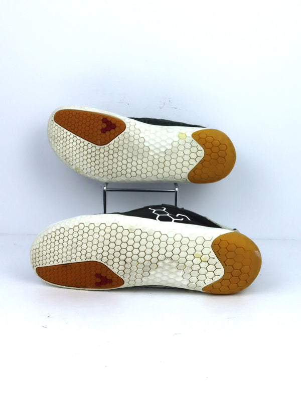 Vivobarefoot Geo Shell barefoot sneakers in black with a white midsole and gum sole accents.