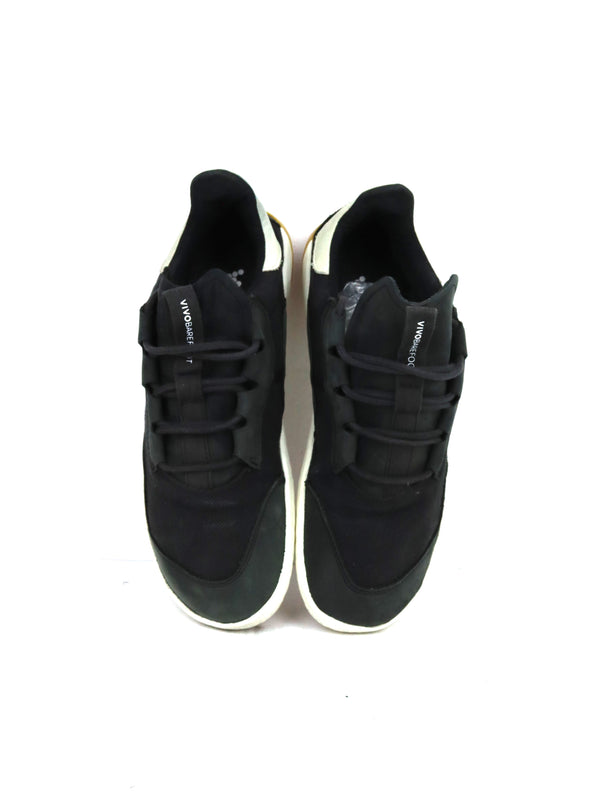 Vivobarefoot Geo Shell barefoot sneakers in black with a white midsole and gum sole accents.