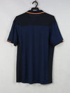 K-Swiss navy blue and black polo shirt with orange trim.