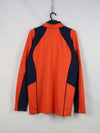 Millet Morpho Zip long-sleeved hiking tee-shirt in orange and blue made with Polartec Power Dry fabric.