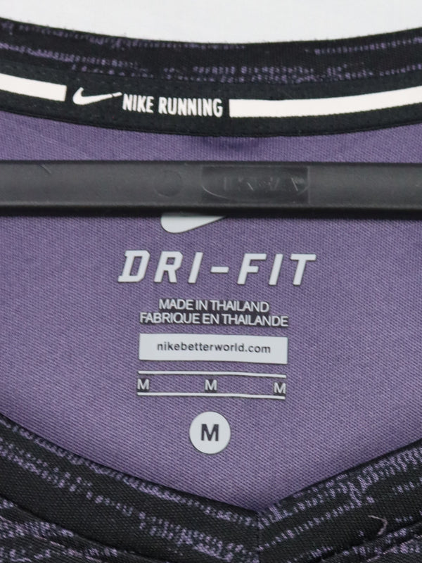 Nike Dri-FIT running top made of a polyester microfiber blend designed to wick away sweat