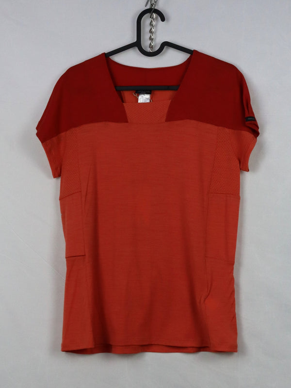 This is a Women's Forclaz Trek 500 coral merino wool mountain trekking t-shirt.