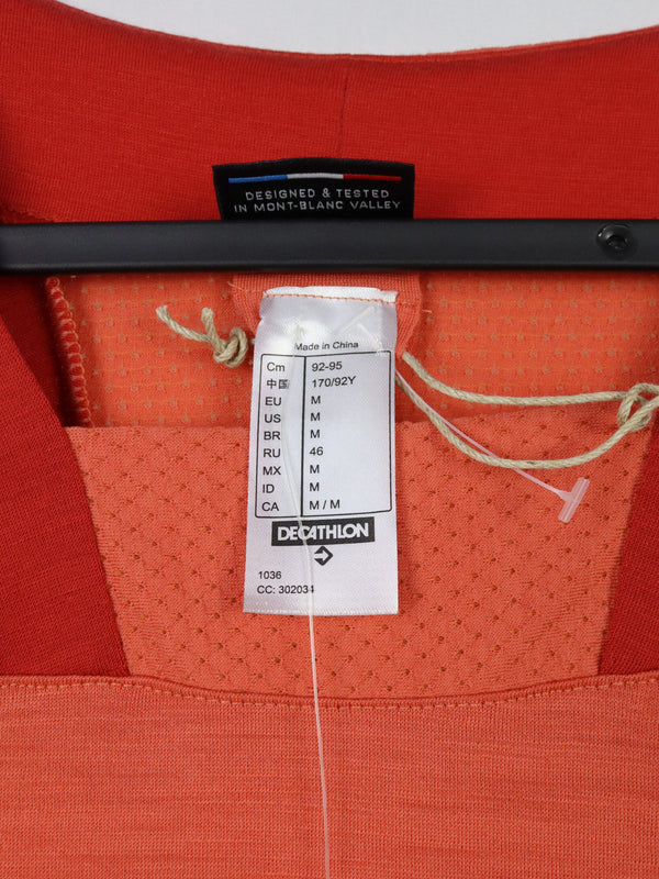 This is a Women's Forclaz Trek 500 coral merino wool mountain trekking t-shirt.