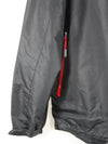 black waterproof windbreaker jacket with a red zipper and hood