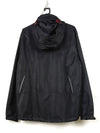 black waterproof windbreaker jacket with a red zipper and hood