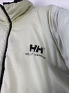Helly Hansen HH Urban Reversible Puffer Jacket in black, featuring synthetic blowable insulation and ripstop fabric.