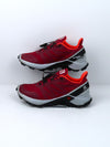 Salomon Supercross trail running shoes in red with black and white accents.