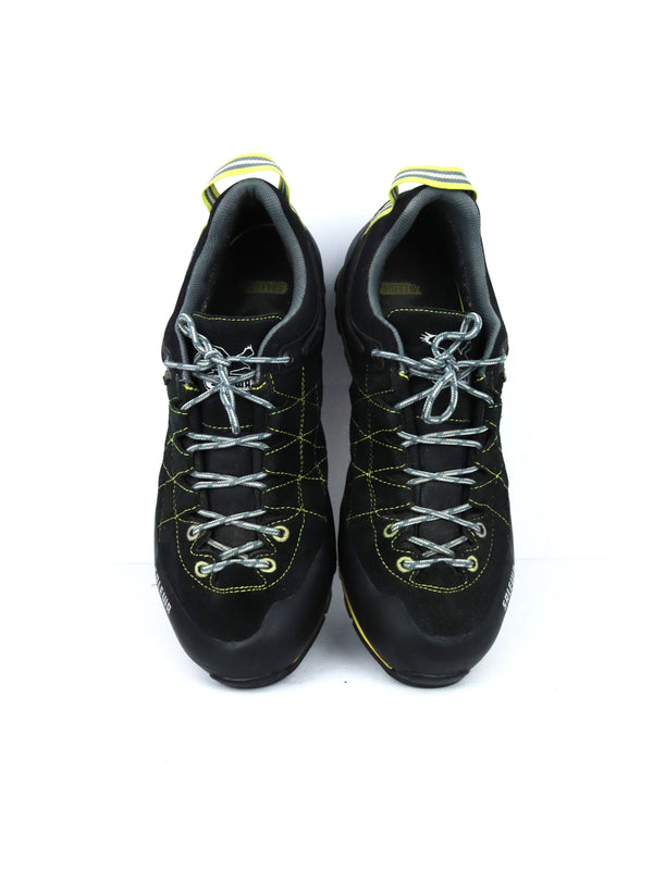 Salewa Mountain Trainer GTX hiking shoes in black with yellow accents, featuring a GORE-TEX lining and a Vibram sole.