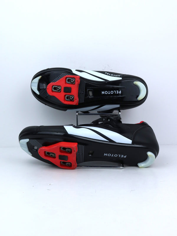 Peloton cycling shoes with red accents.