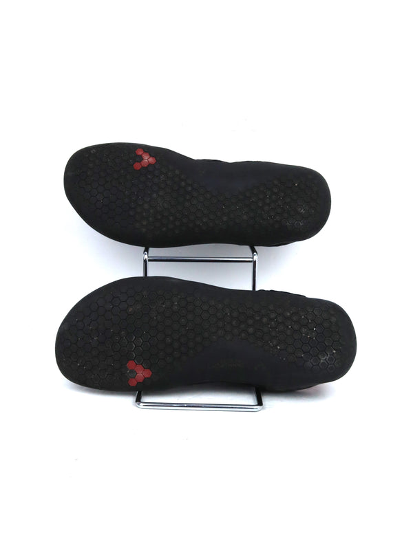 Vivobarefoot Stealth II running shoes in a black and red colorway.