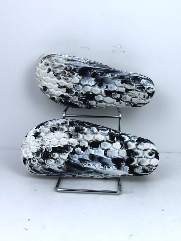 Vivobarefoot Ultra Bloom kids' junior footwear in a black, white, and aqua color.
