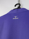 Selpa cycling jersey in purple with a quarter-zip neck and gray side panels.