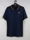 K-Swiss navy blue and black polo shirt with orange trim.