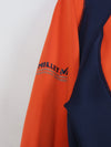 Millet Morpho Zip long-sleeved hiking tee-shirt in orange and blue made with Polartec Power Dry fabric.