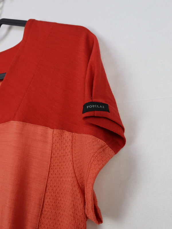 This is a Women's Forclaz Trek 500 coral merino wool mountain trekking t-shirt.