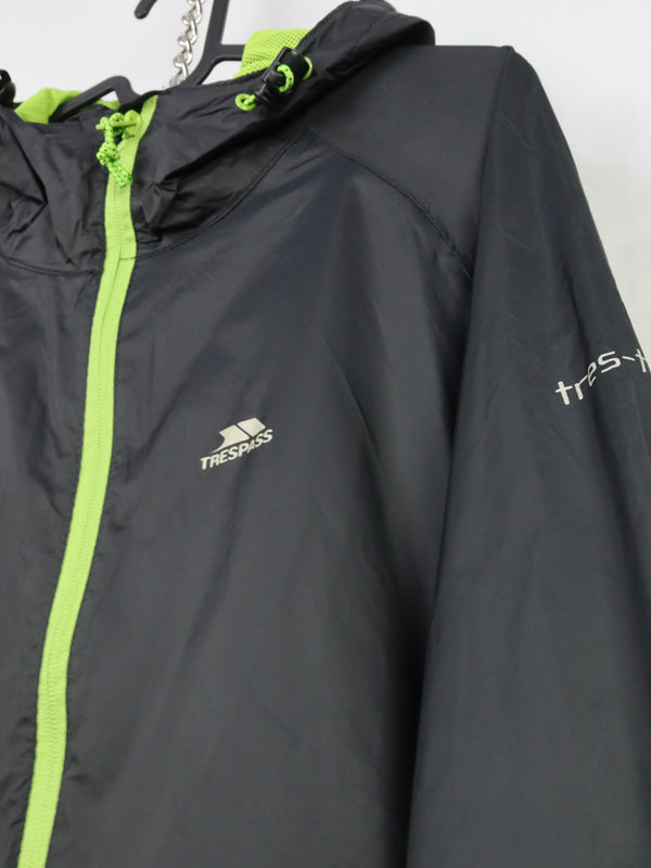 Trespass Unisex Qikpac waterproof packaway jacket with a lime green zipper.