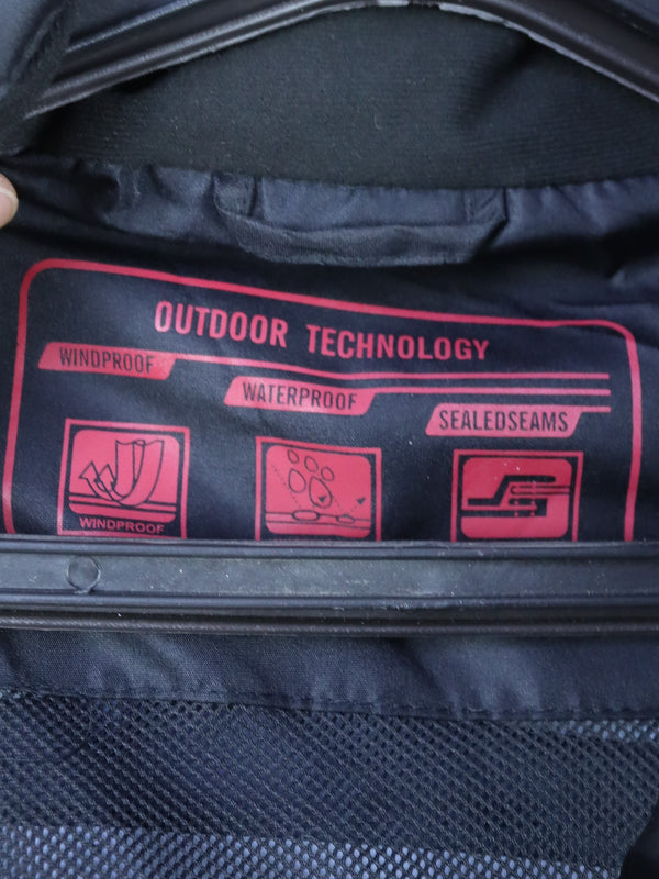 black waterproof windbreaker jacket with a red zipper and hood