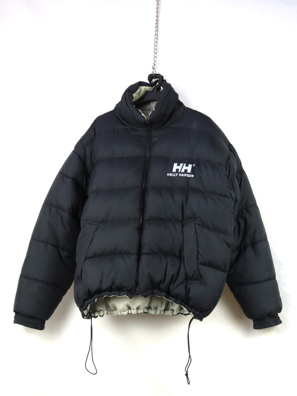 Helly Hansen HH Urban Reversible Puffer Jacket in black, featuring synthetic blowable insulation and ripstop fabric.