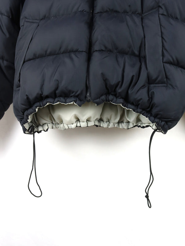 Helly Hansen HH Urban Reversible Puffer Jacket in black, featuring synthetic blowable insulation and ripstop fabric.