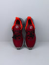 Salomon Supercross trail running shoes in red with black and white accents.