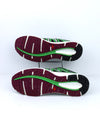 Salomon X Tour City running shoe in green with black and white accents.