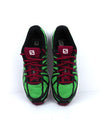 Salomon X Tour City running shoe in green with black and white accents.
