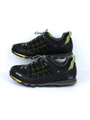 Salewa Mountain Trainer GTX hiking shoes in black with yellow accents, featuring a GORE-TEX lining and a Vibram sole.
